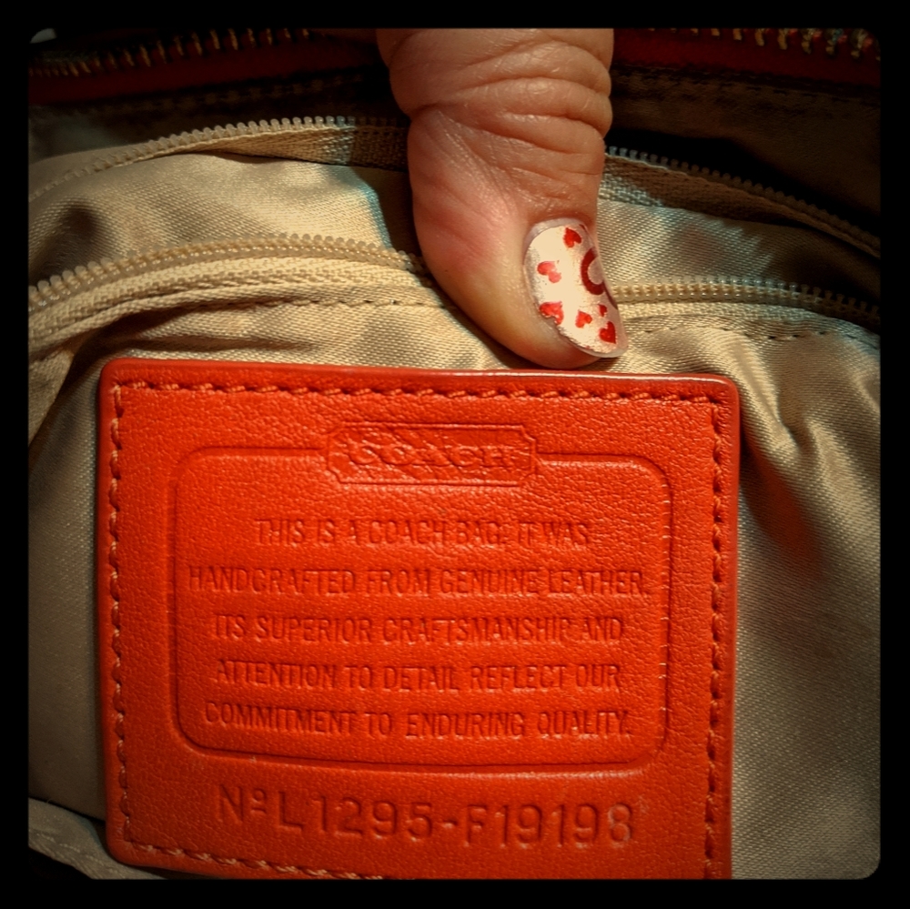 Salmon colored coach purse